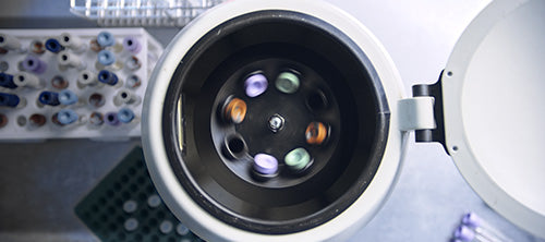 Centrifuge spinning with test tubes on the side